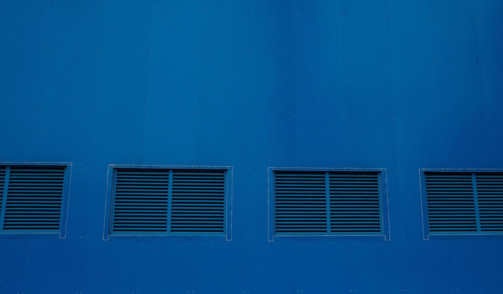 Blue window on the wall turbine building power plant project. The photo is suitable to use for project background and safety poster and content media.