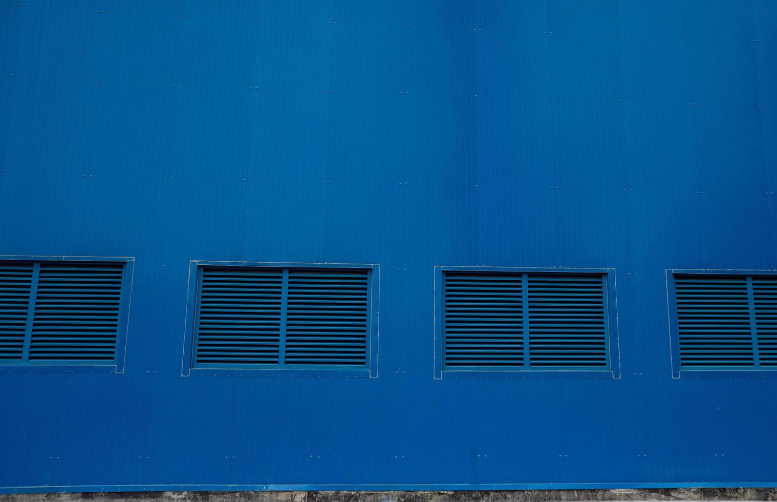 Blue window on the wall turbine building power plant project. The photo is suitable to use for project background and safety poster and content media.