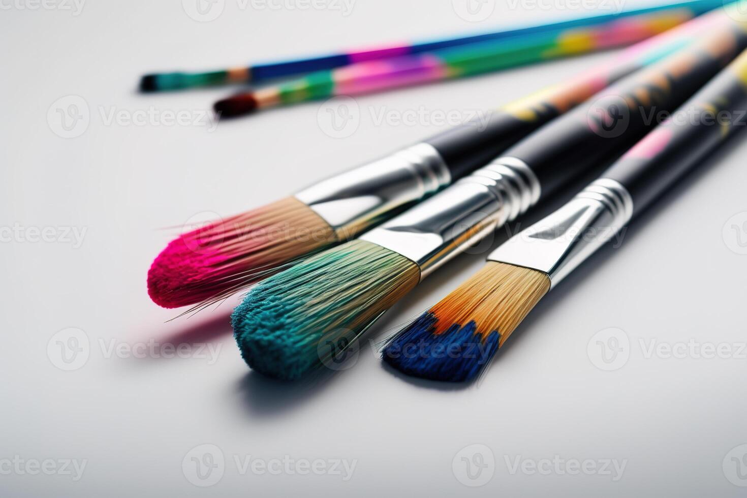 Colorful Paint Brushes with isolated white background and copy space. photo