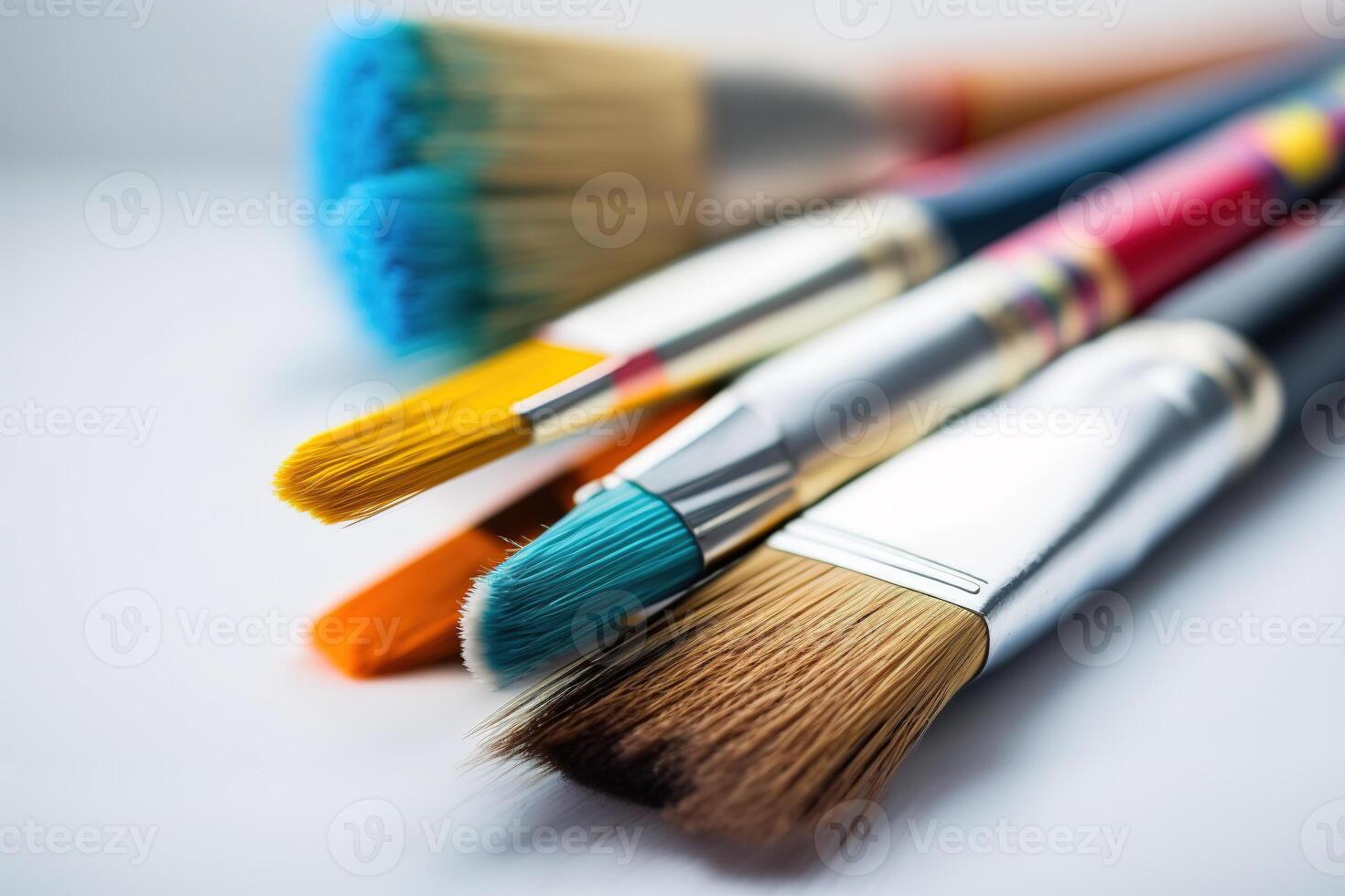 Colorful Paint Brushes with isolated white background and copy space. photo