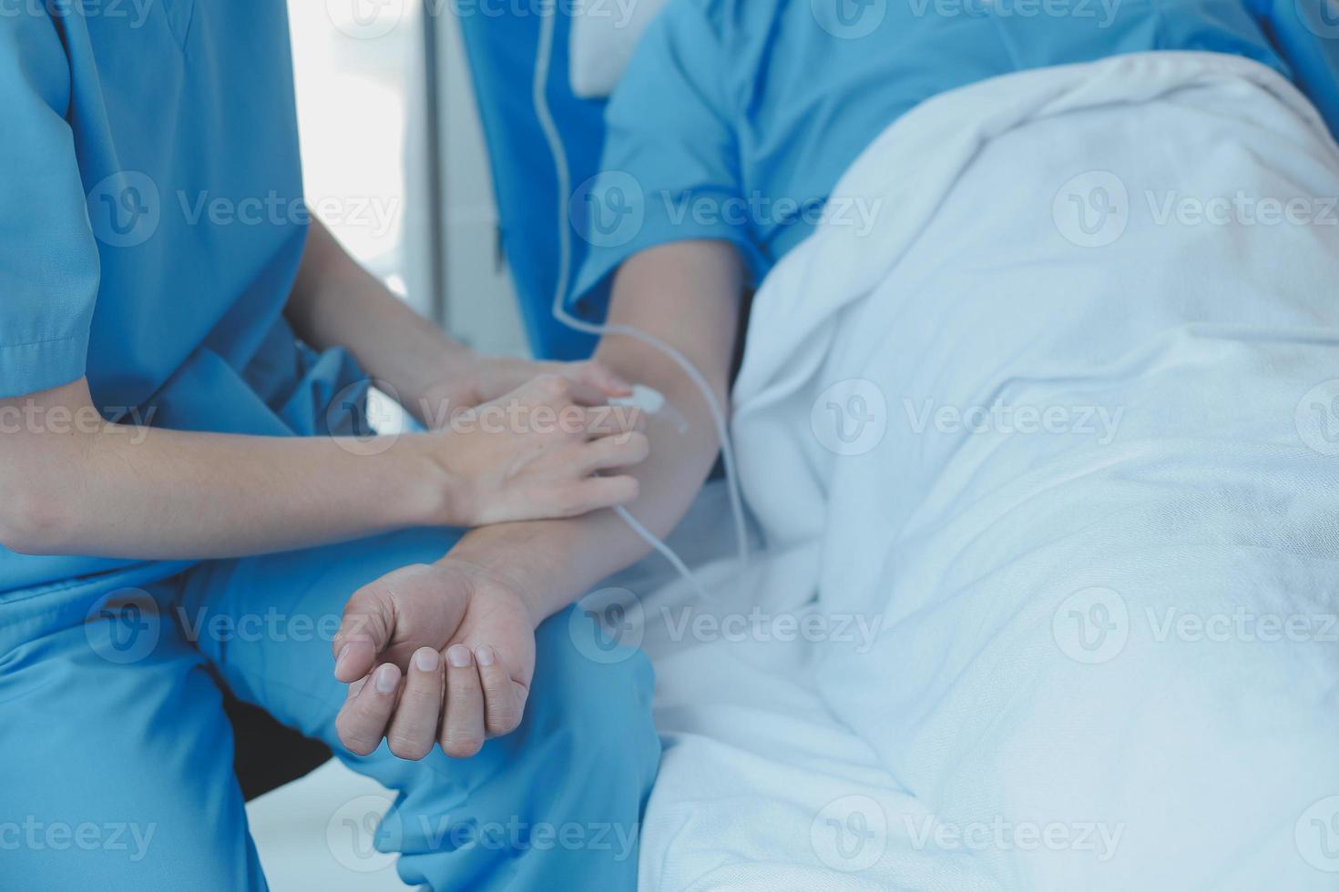 Injured patient showing doctor broken wrist and arm with bandage in hospital office or emergency room. Sprain, stress fracture or repetitive strain injury in hand. Nurse helping customer. First aid. photo