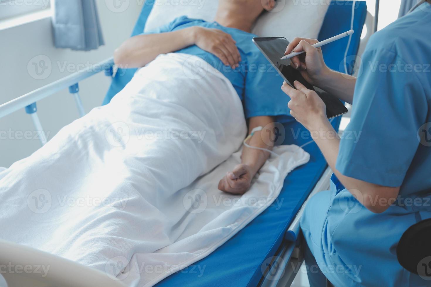 Injured patient showing doctor broken wrist and arm with bandage in hospital office or emergency room. Sprain, stress fracture or repetitive strain injury in hand. Nurse helping customer. First aid. photo