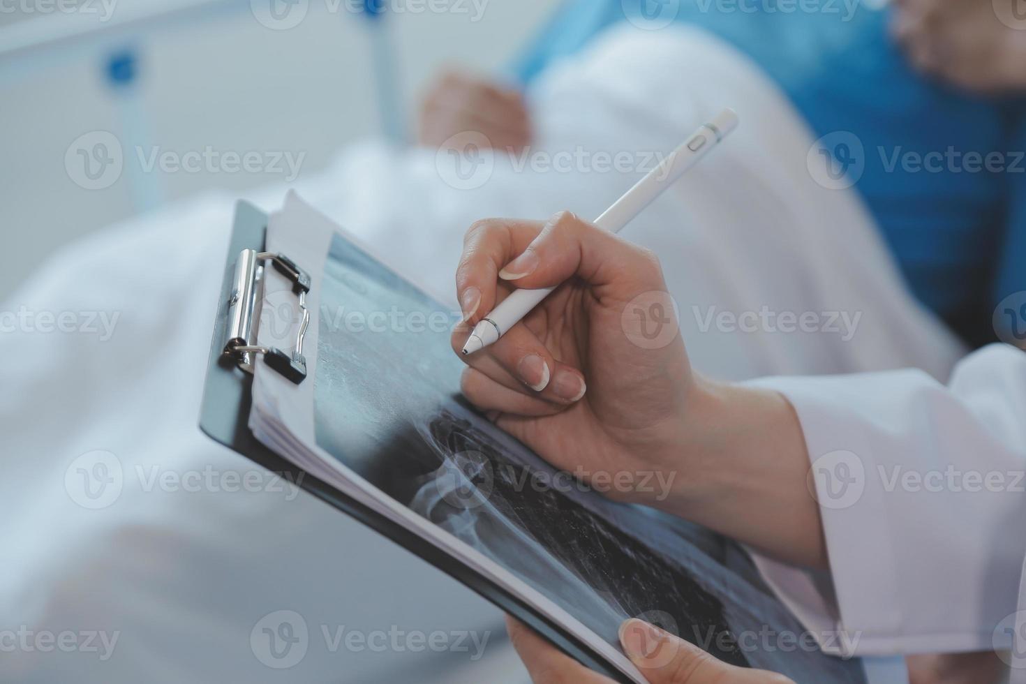 Injured patient showing doctor broken wrist and arm with bandage in hospital office or emergency room. Sprain, stress fracture or repetitive strain injury in hand. Nurse helping customer. First aid. photo