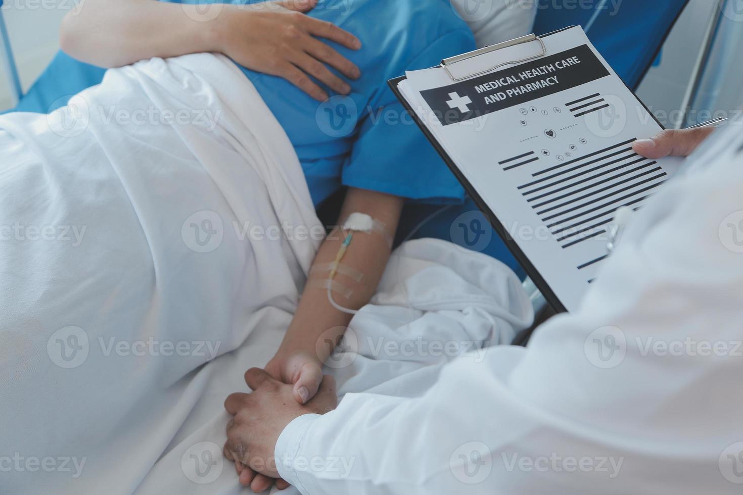 Injured patient showing doctor broken wrist and arm with bandage in hospital office or emergency room. Sprain, stress fracture or repetitive strain injury in hand. Nurse helping customer. First aid. photo