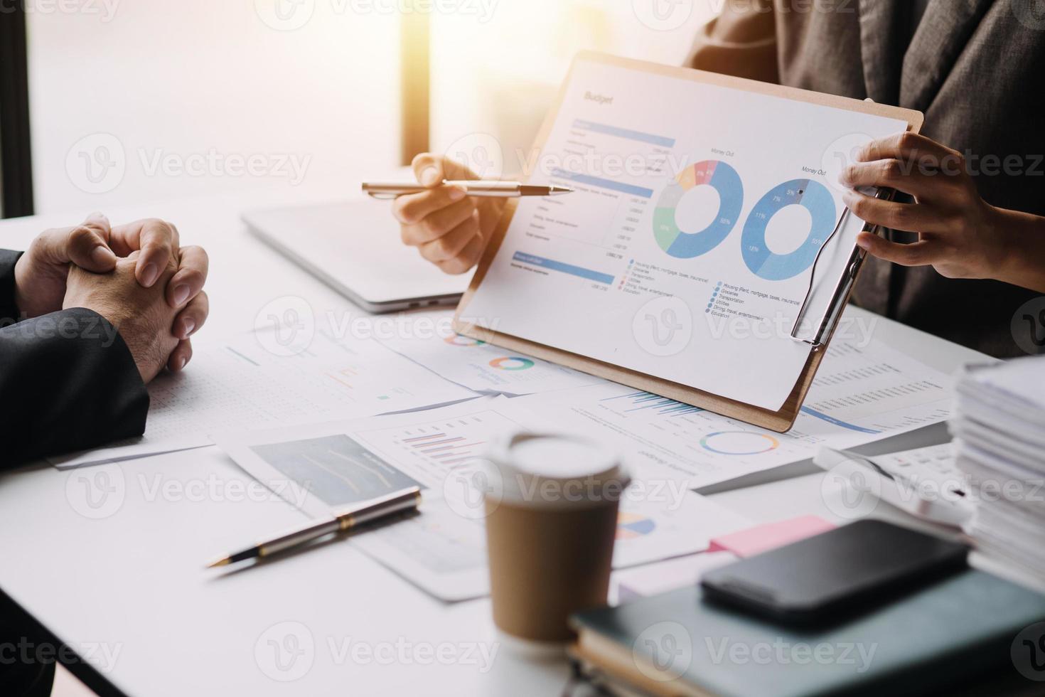 Businesswoman or accountant working Financial investment on calculator, calculate, analyze business and marketing growth on financial document data graph, Accounting, Economic, commercial concept. photo