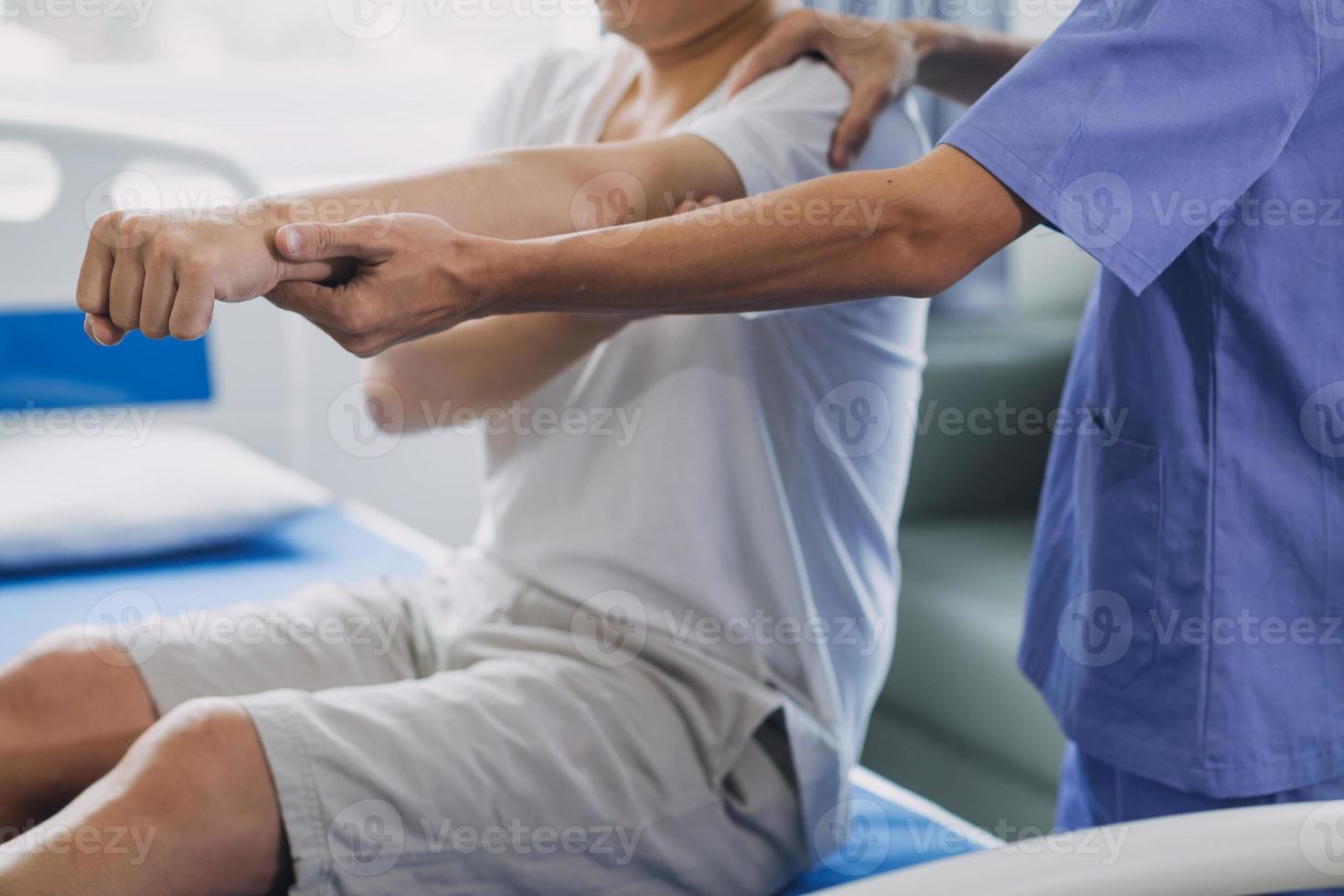 Physiotherapist working with patient in clinic, closeup photo