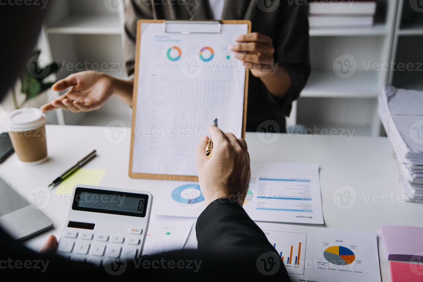 Businesswoman or accountant working Financial investment on calculator, calculate, analyze business and marketing growth on financial document data graph, Accounting, Economic, commercial concept. photo