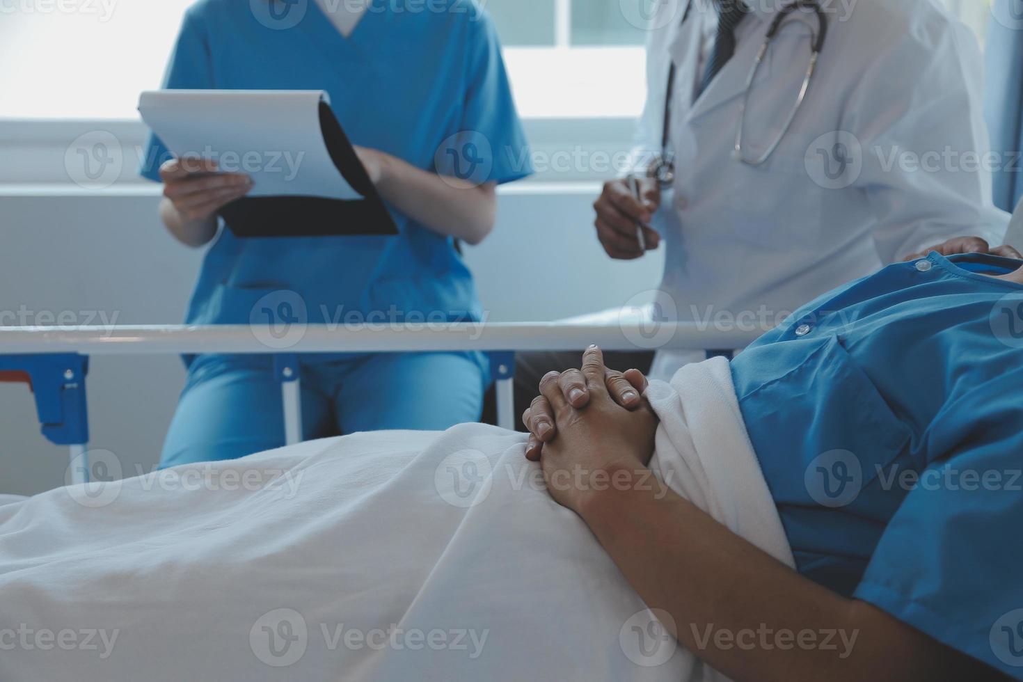 Injured patient showing doctor broken wrist and arm with bandage in hospital office or emergency room. Sprain, stress fracture or repetitive strain injury in hand. Nurse helping customer. First aid. photo