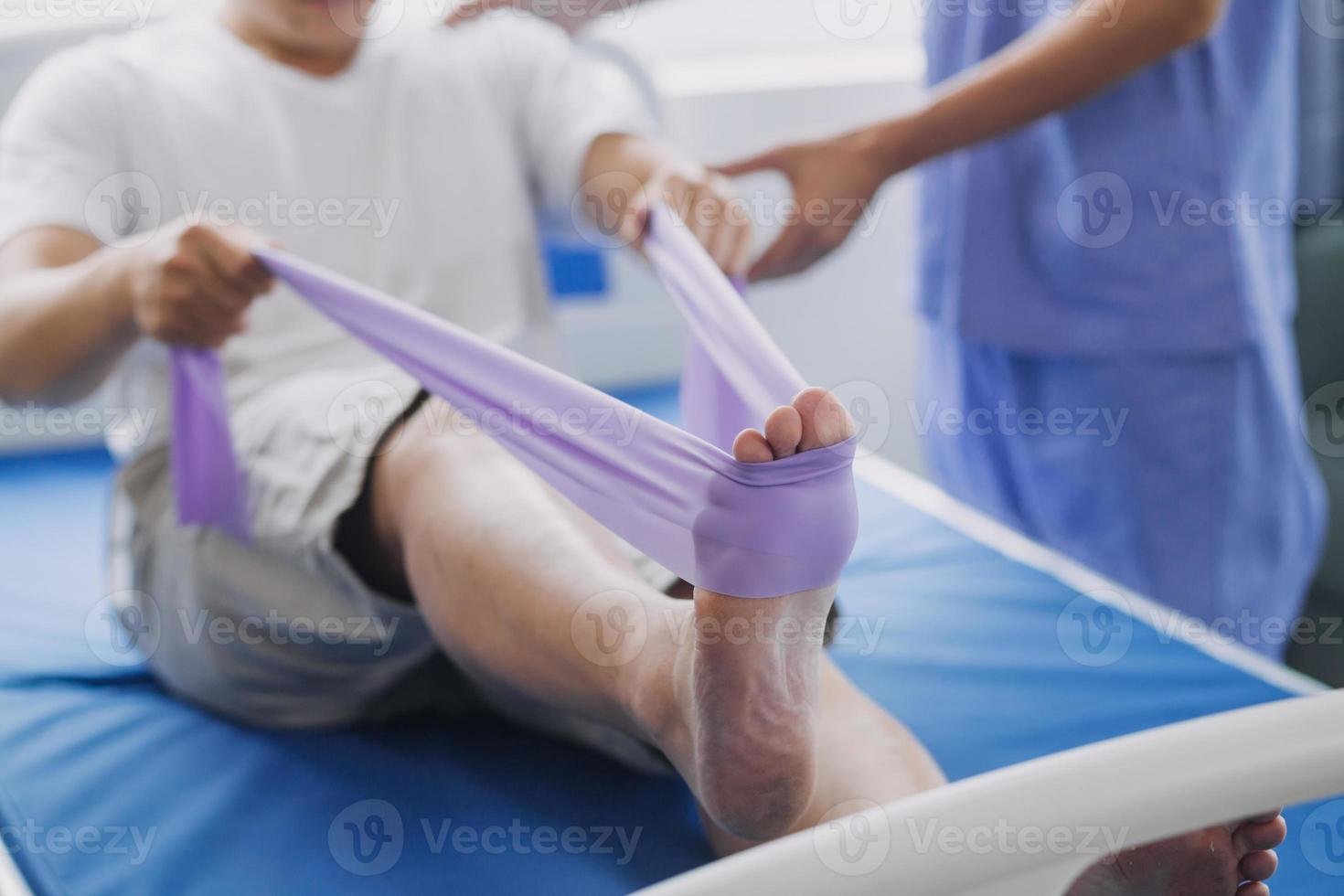 Physiotherapist working with patient in clinic, closeup photo