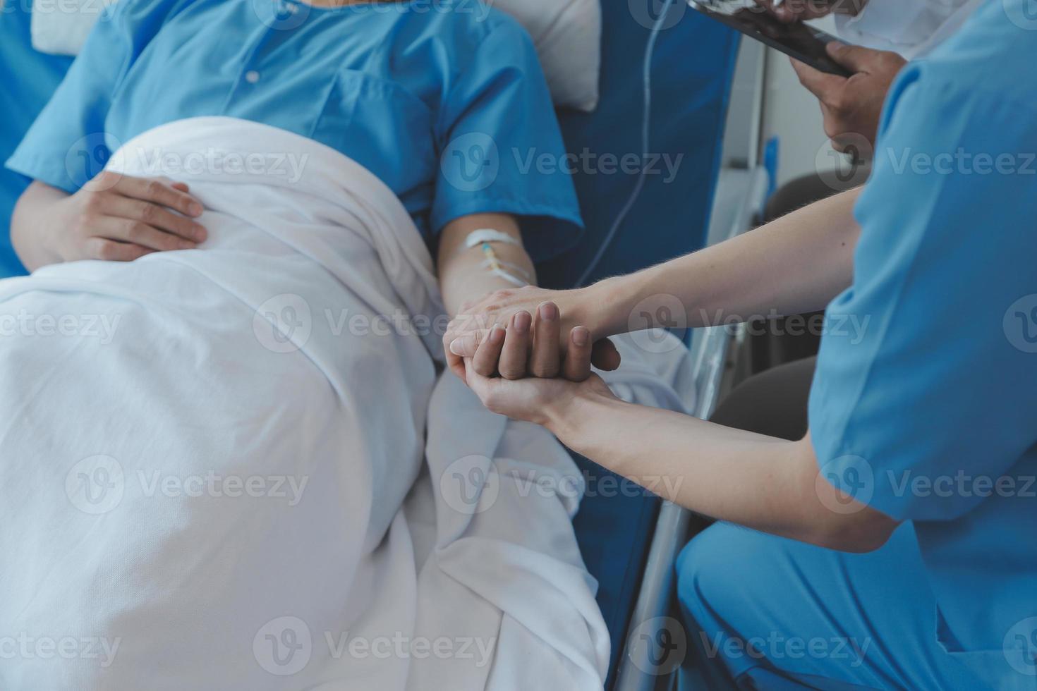 Injured patient showing doctor broken wrist and arm with bandage in hospital office or emergency room. Sprain, stress fracture or repetitive strain injury in hand. Nurse helping customer. First aid. photo