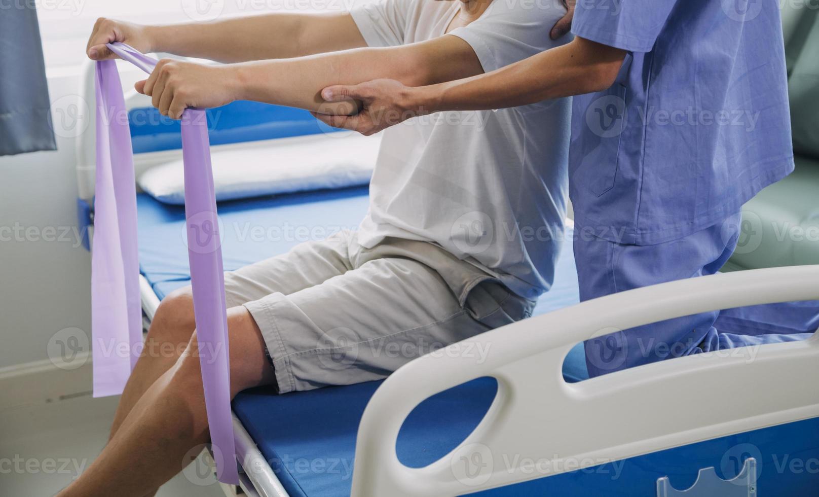 Physiotherapist working with patient in clinic, closeup photo