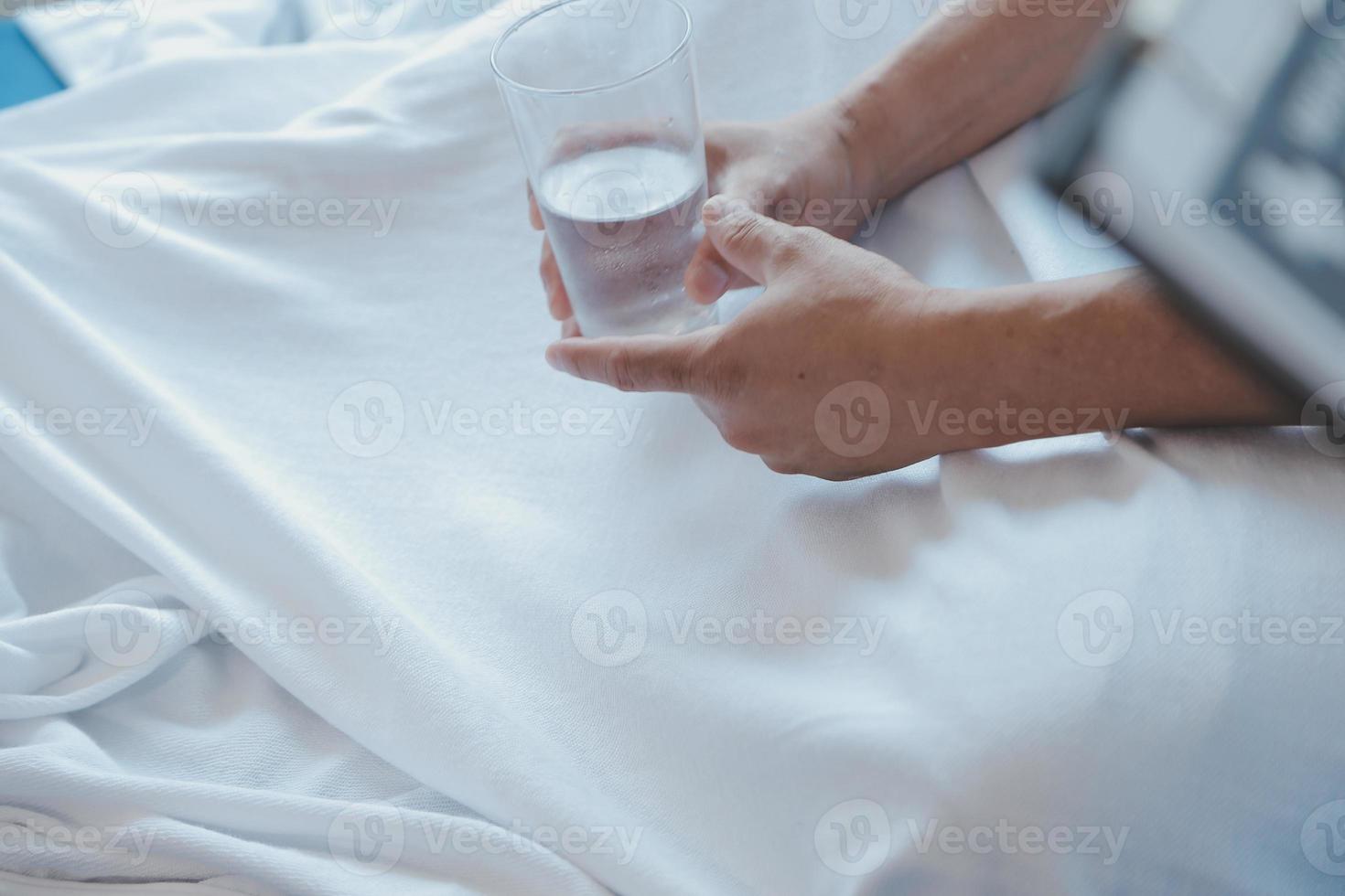 Injured patient showing doctor broken wrist and arm with bandage in hospital office or emergency room. Sprain, stress fracture or repetitive strain injury in hand. Nurse helping customer. First aid. photo