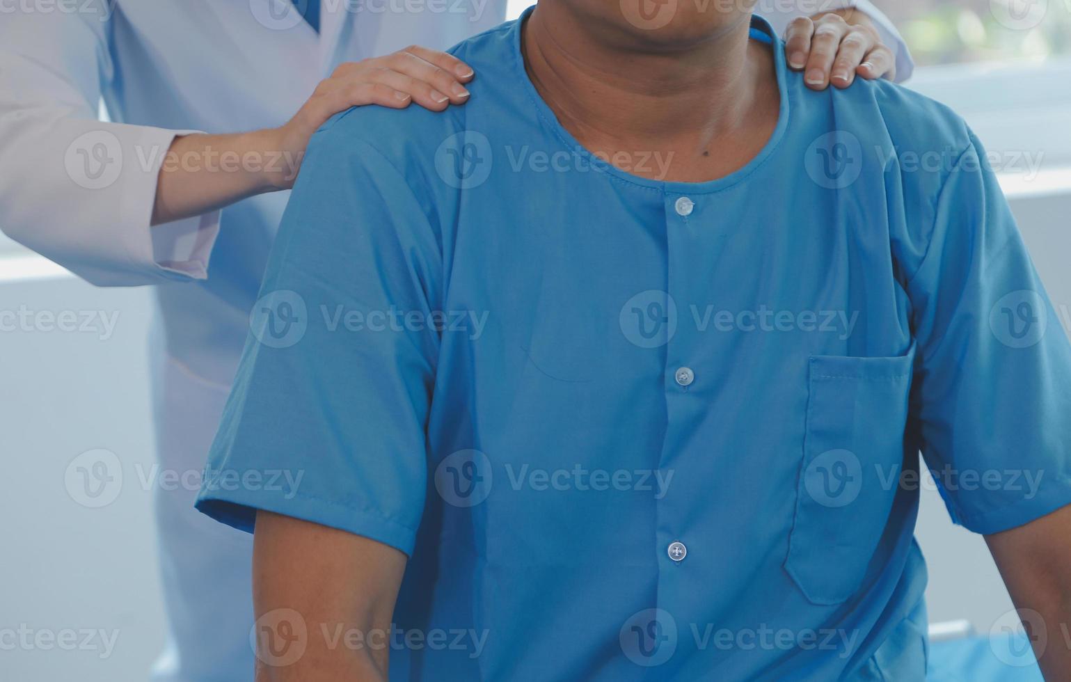 Patient doing some special exercises under supervision in a room photo