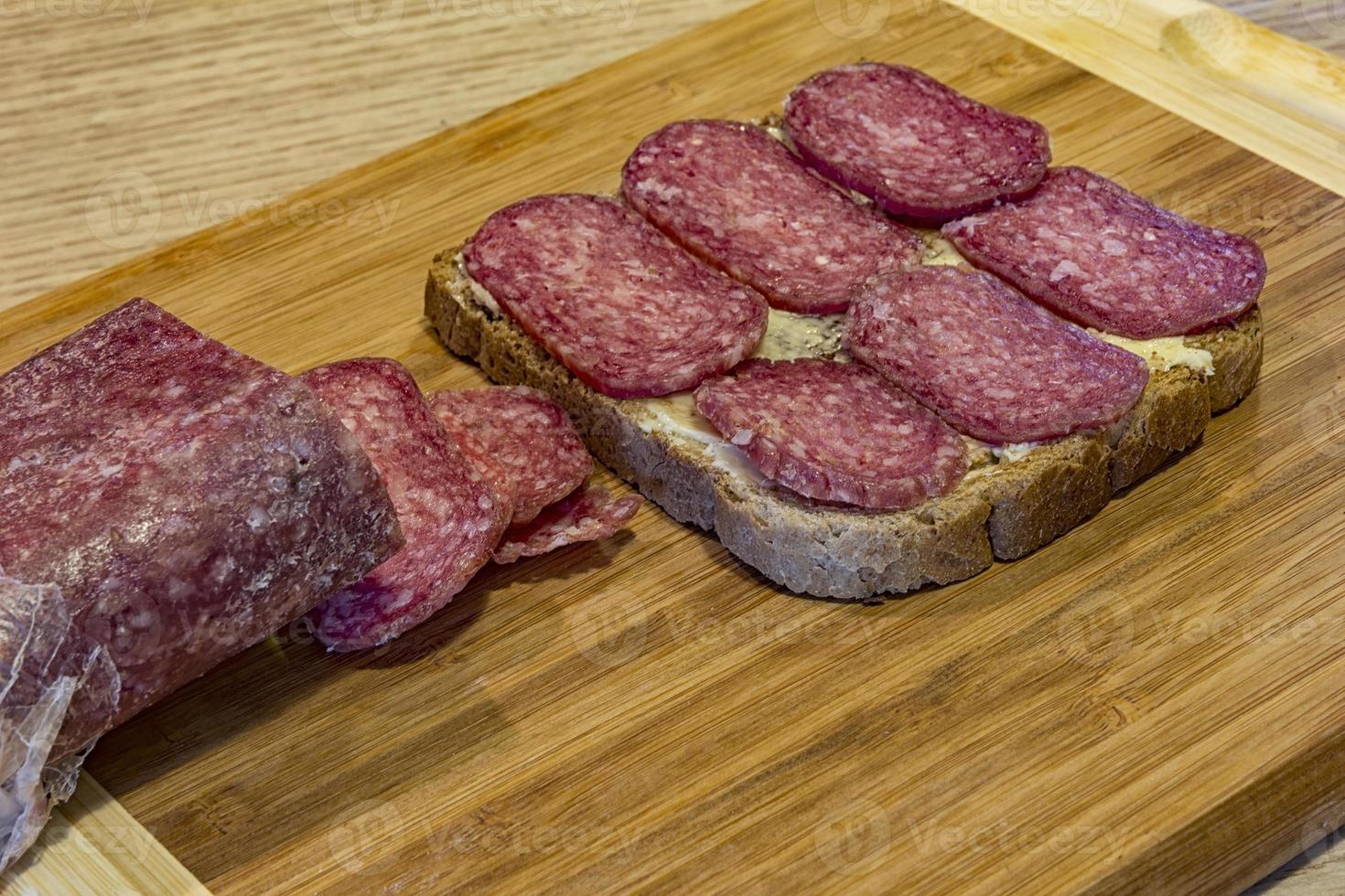 homemade sandwich with meat and bread on the table photo