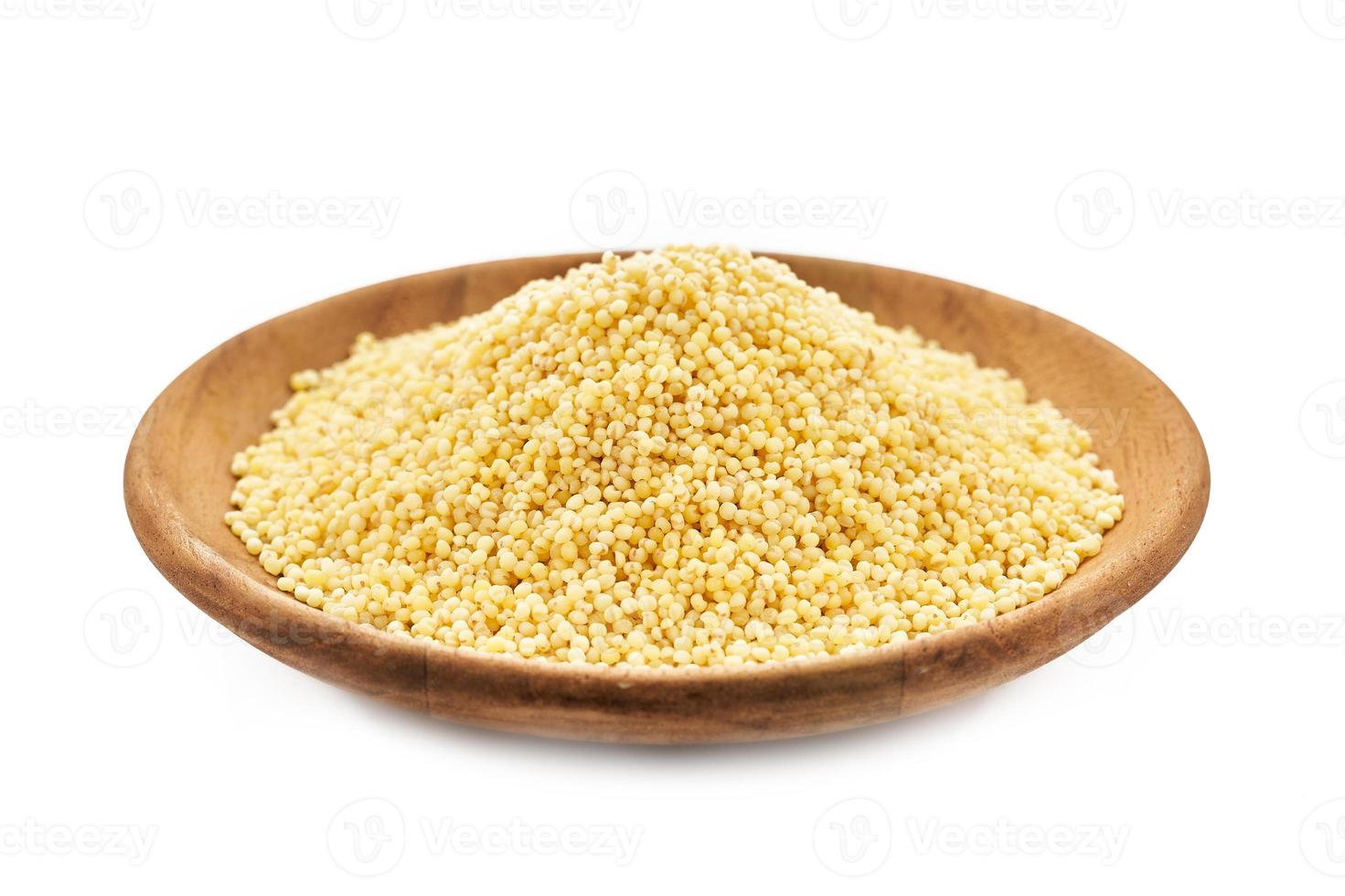 pile of sorghum or sorghum grain, millet grain or millet seed in wood plate isolated on white background photo