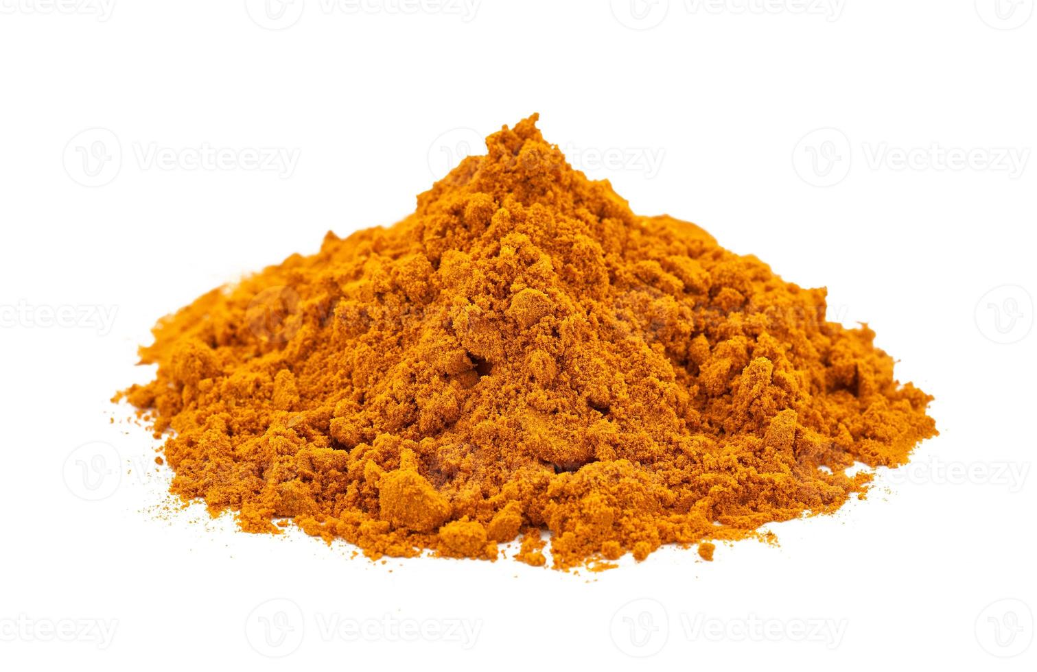 a pile of ground turmeric powder or curcumin powder isolated on white background. turmeric or curcumin powder isolated photo