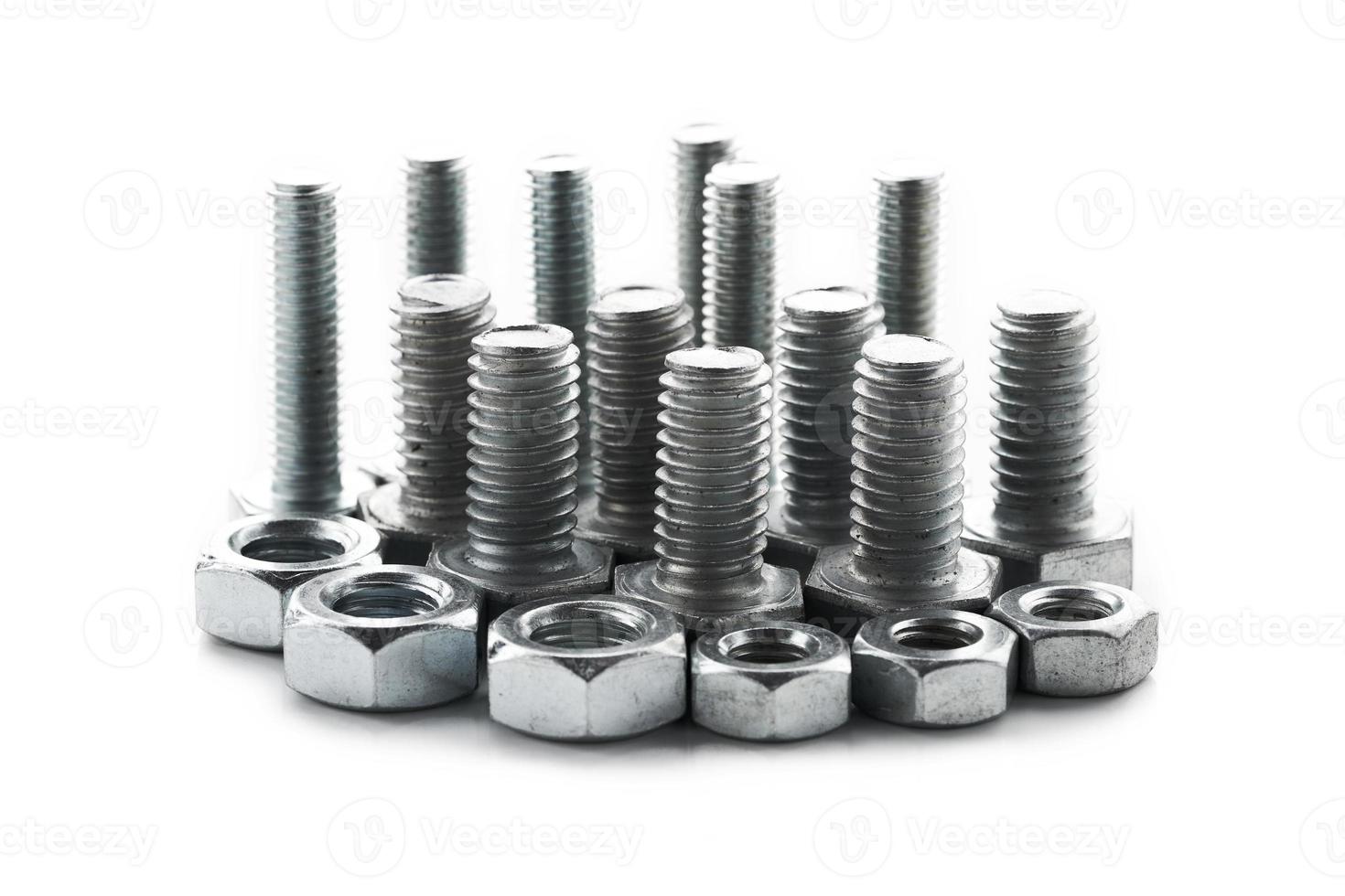 close-up steel nut screw isolated on white background. group of steel metal nut and screw isolated on white background. metal, fastener, bolt, iron, nut, screw photo