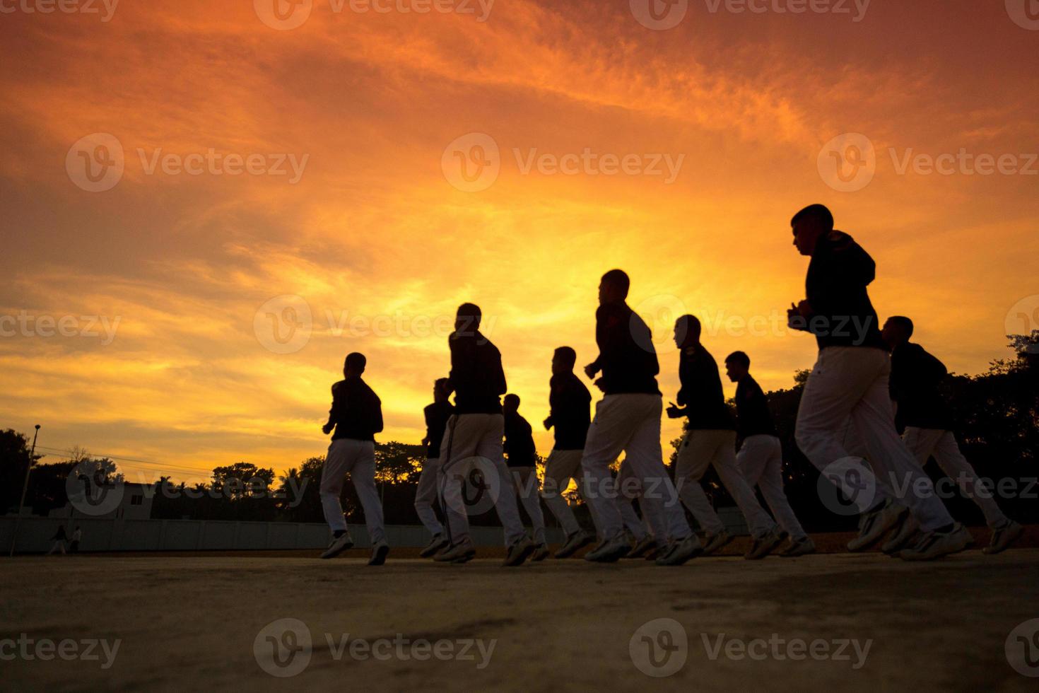 Some of the young trained soldiers are exercising on the early morning golden time. photo