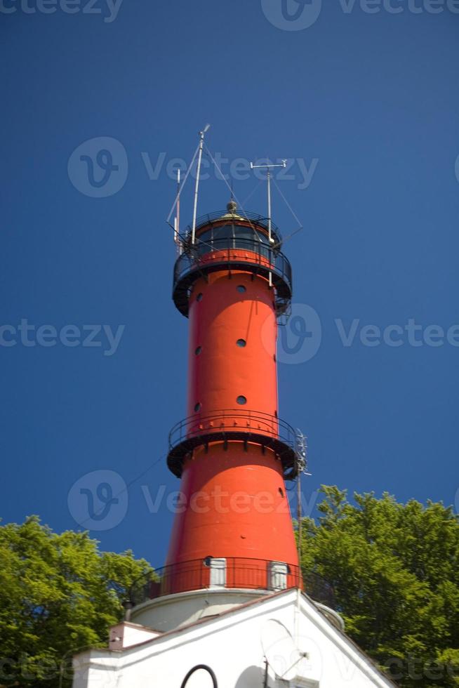 Lighthouse on blue sky photo