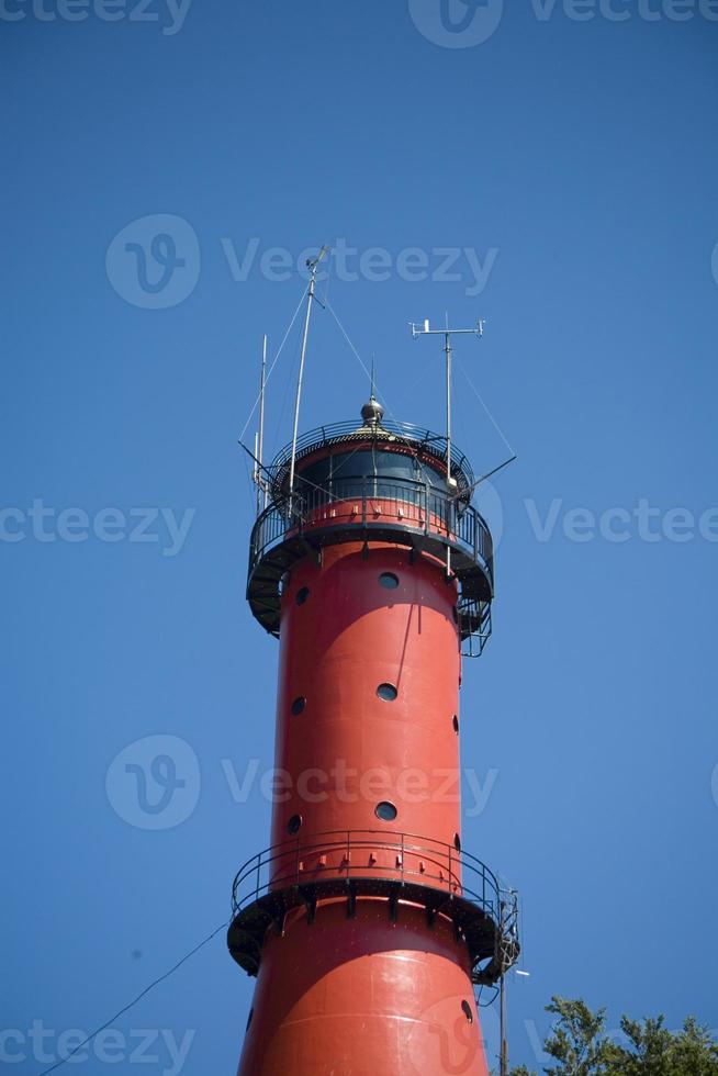 Lighthouse on blue sky photo