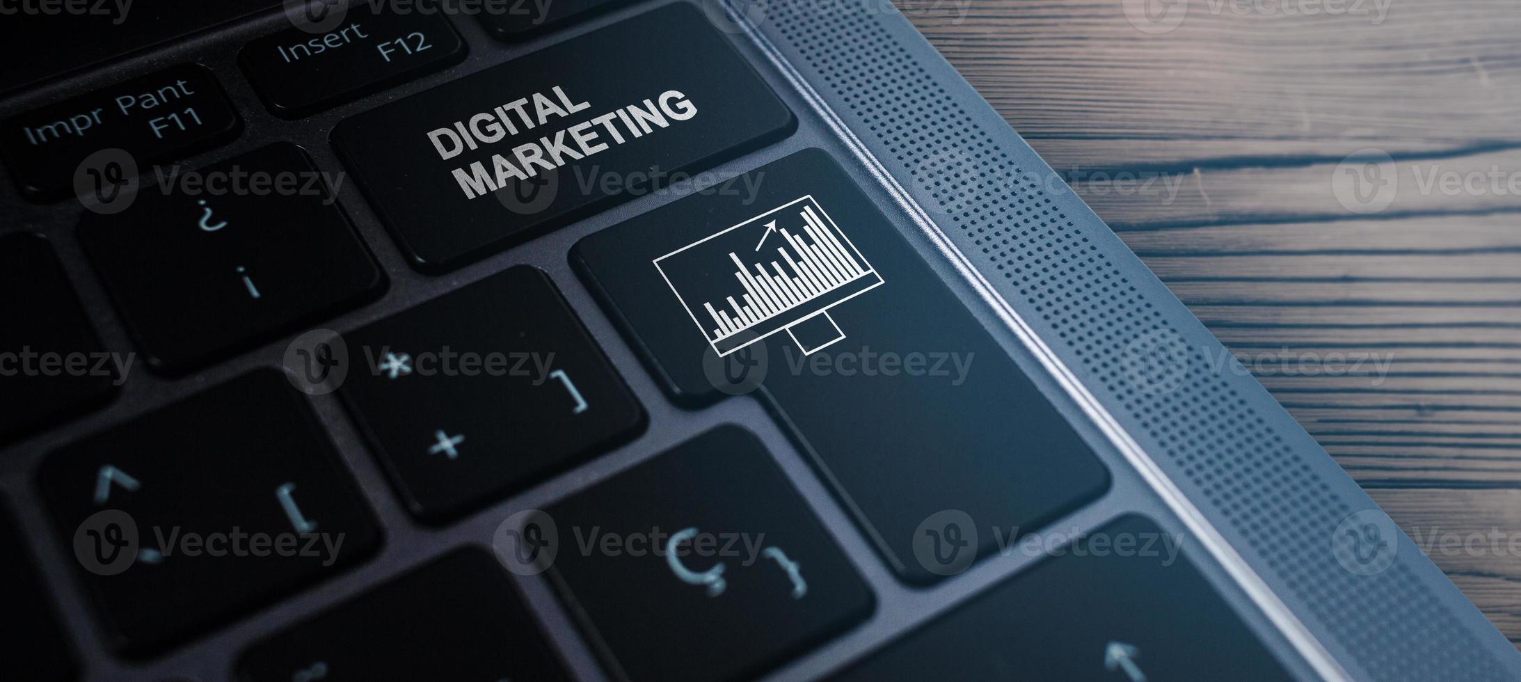 Laptop keyboard with the words ,Digital Marketing, on button. Digital marketing technology concept. Internet. Online. Search Engine Optimisation. SEO. SMM. Video Advertising. photo