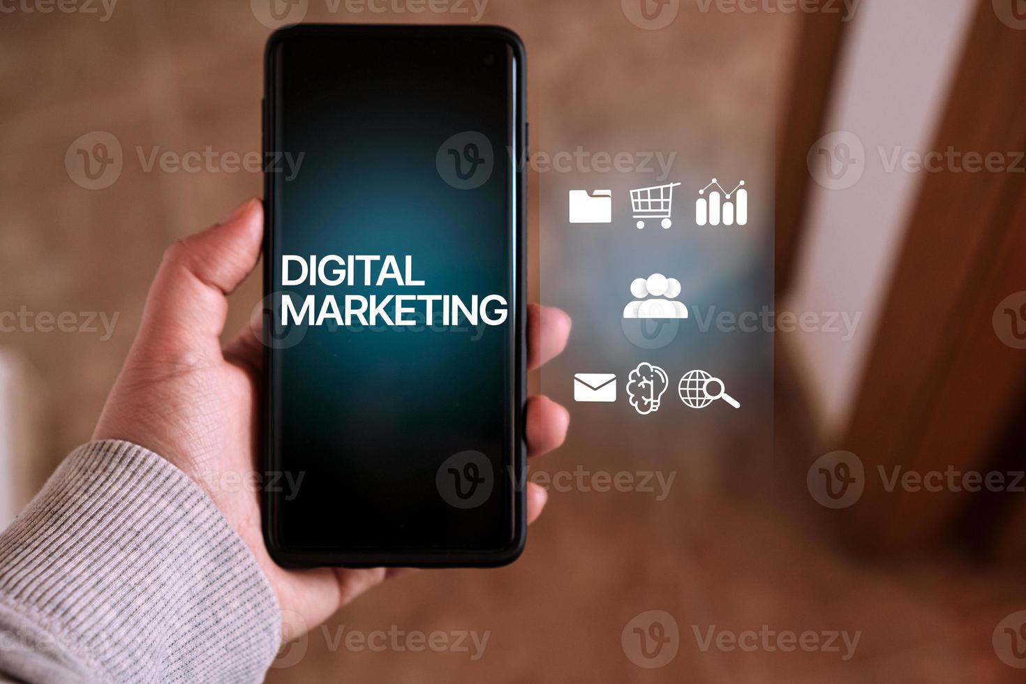 Woman usign smartphone with, Digital Marketing, on screen and VR interface. Digital marketing technology concept. Internet. Online. Search Engine Optimisation. SEO. SMM. Video Advertising. photo