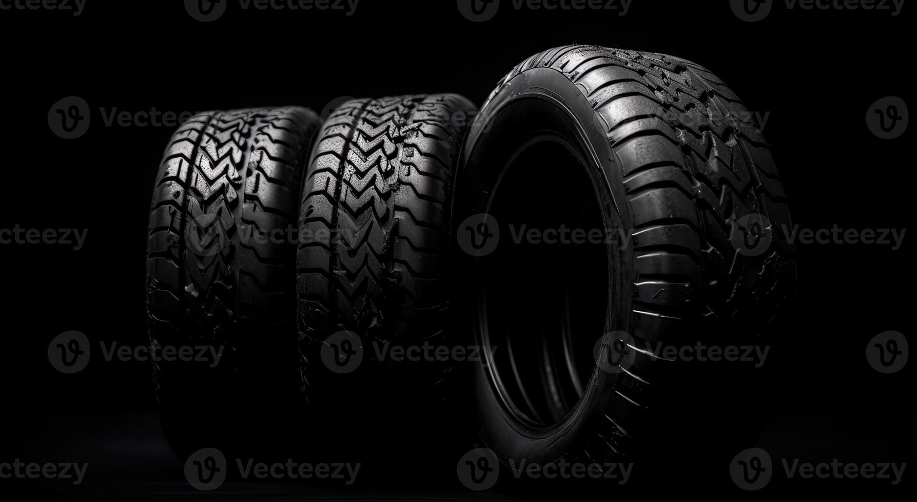 New car tires. Group of road wheels on dark background. Summer Tires with asymmetric tread design. Driving car concept. . photo