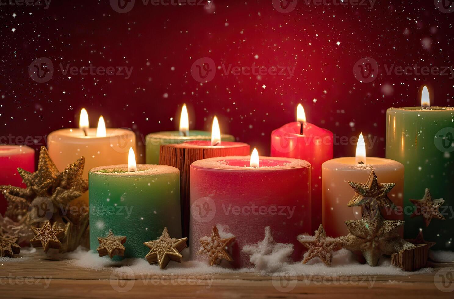 Burning candle and Christmas decoration over snow and wooden background. . photo