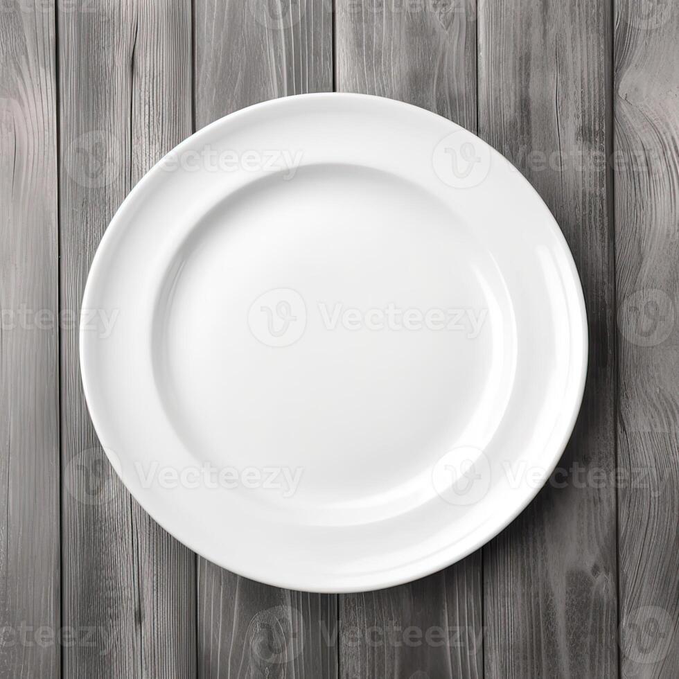 An empty plate on a white wooden table. Top view of white ceramic plate on white wooden. . photo