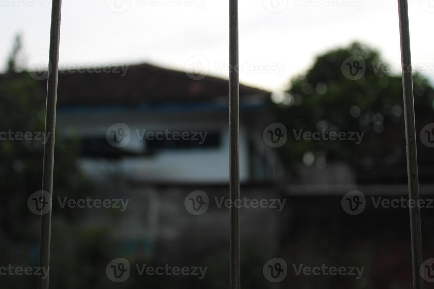 photo of iron bars looking out view