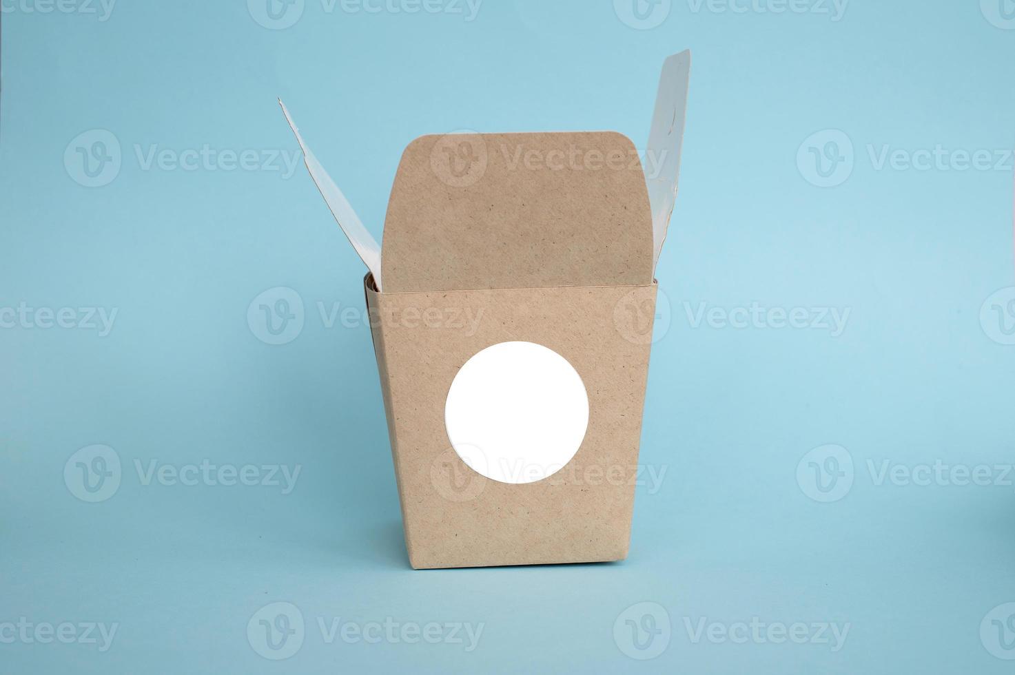 Round sticker mockup on open kraft box, lunch box, packaging with blank sticker, adhesive label photo