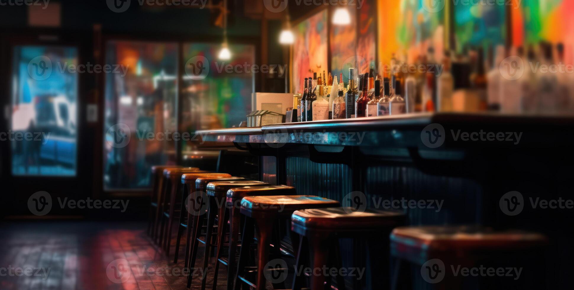 Dimly lit pub interior evokes warmth, with its bar counter and wooden chairs. photo