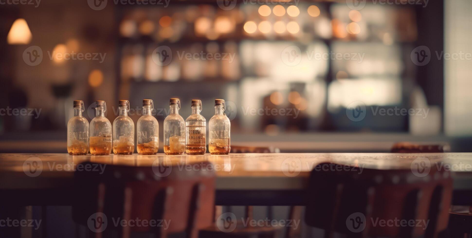 Dimly lit pub interior evokes warmth, with its bar counter and wooden chairs. photo