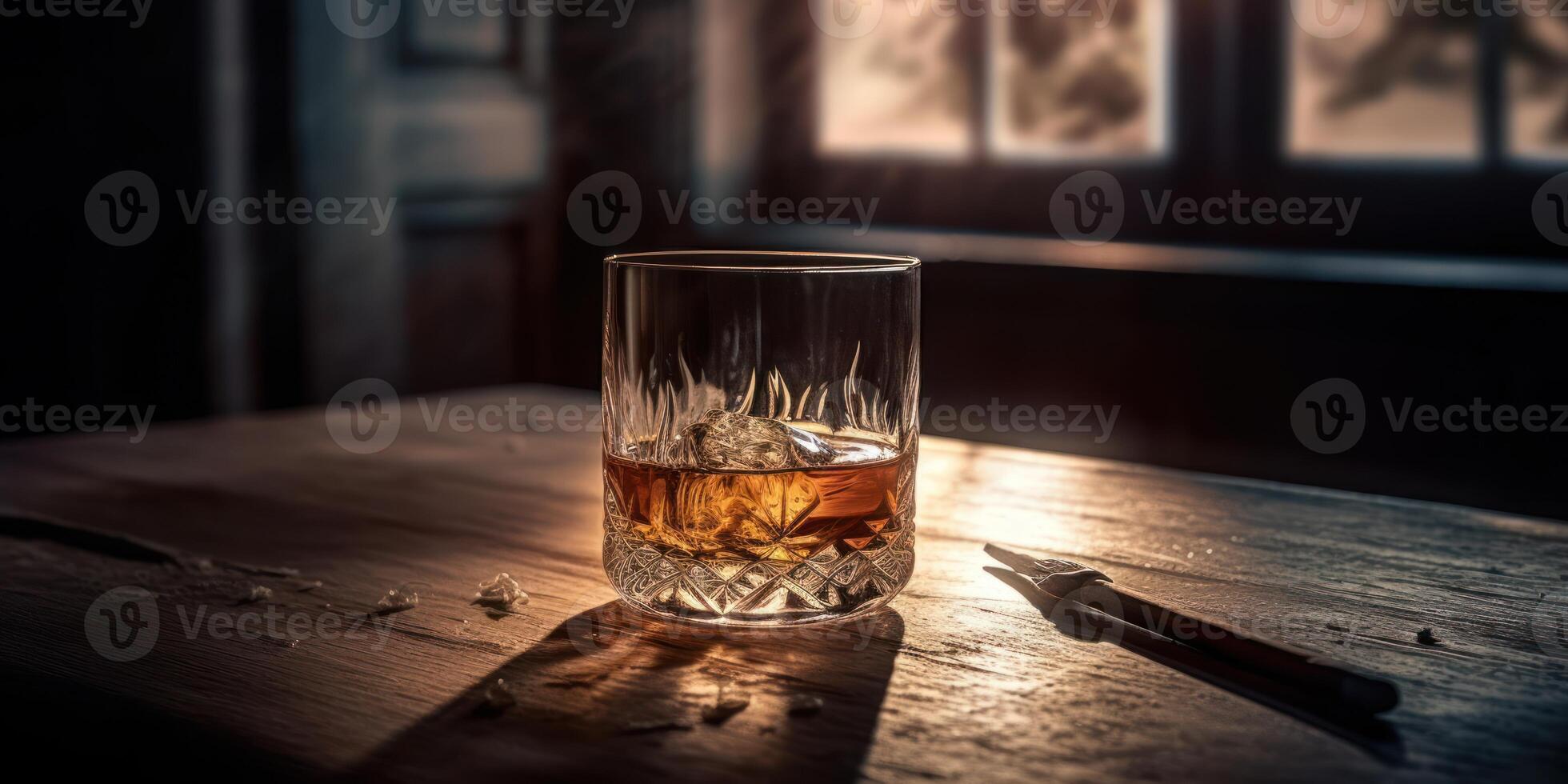 Rich whiskey in a glass, poised elegantly on a wooden table. photo