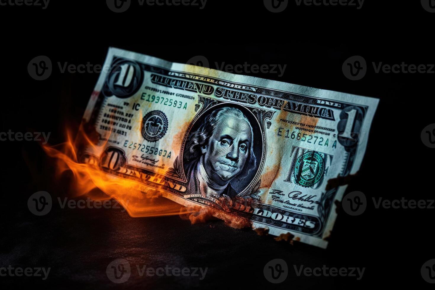 Flames consume dollar bills, symbolizing financial turmoil and loss. photo