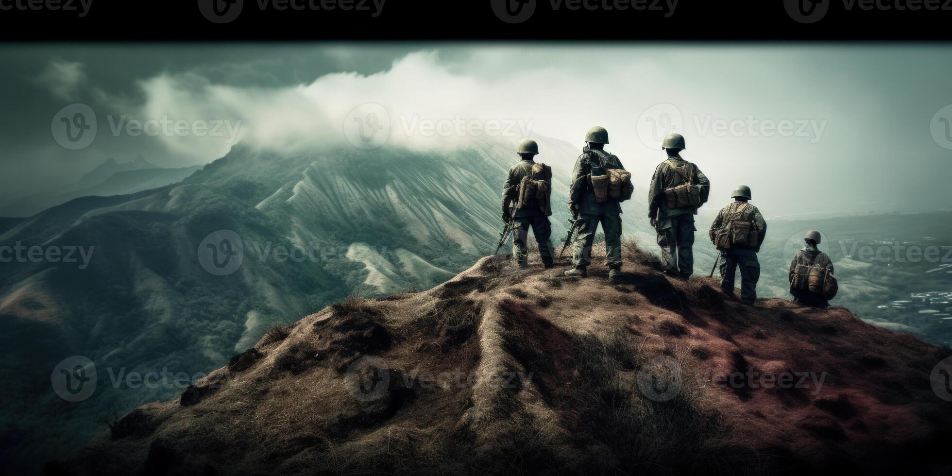 Determined soldiers survey terrain from mountaintop, embodying resilience. photo