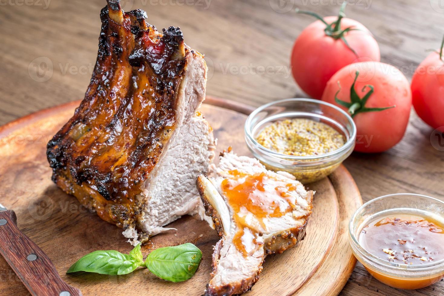 Grilled pork ribs in barbecue sauce photo