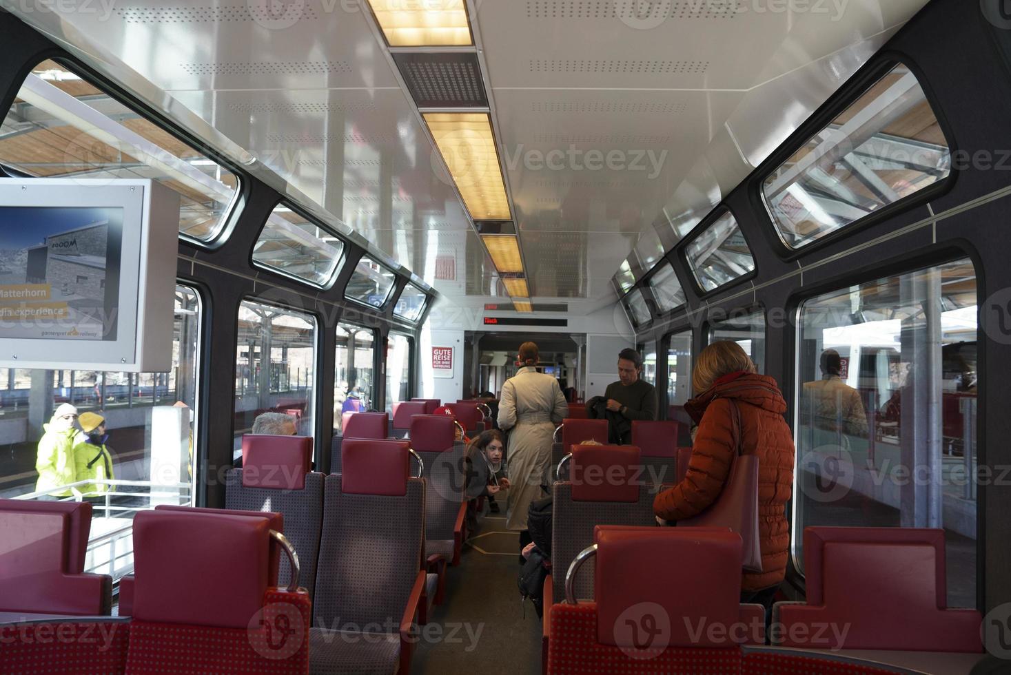 Passengers traveling in modern subway train photo