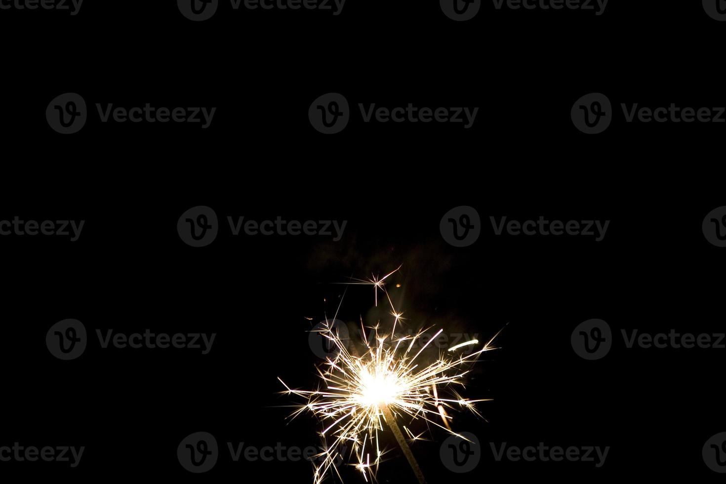 sparklers on a black background photo