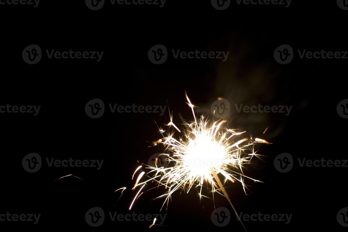sparklers on a black background photo