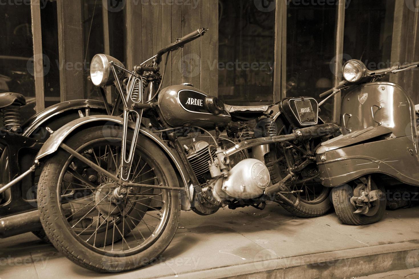 original old vintage retro vintage motorbikes standing in the museum photo