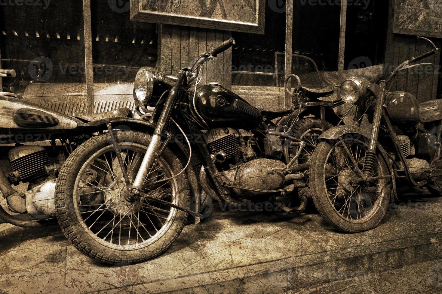 original old vintage retro vintage motorbikes standing in the museum photo