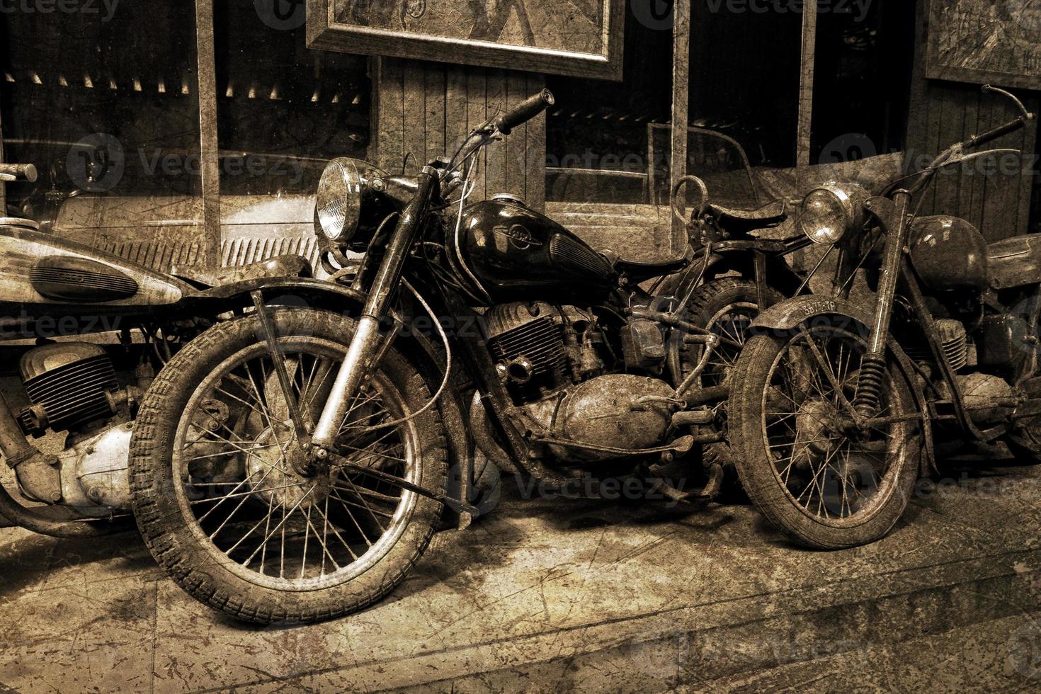 original old vintage retro vintage motorbikes standing in the museum photo