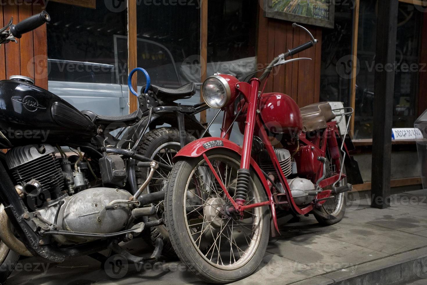 original old vintage retro vintage motorbikes standing in the museum photo