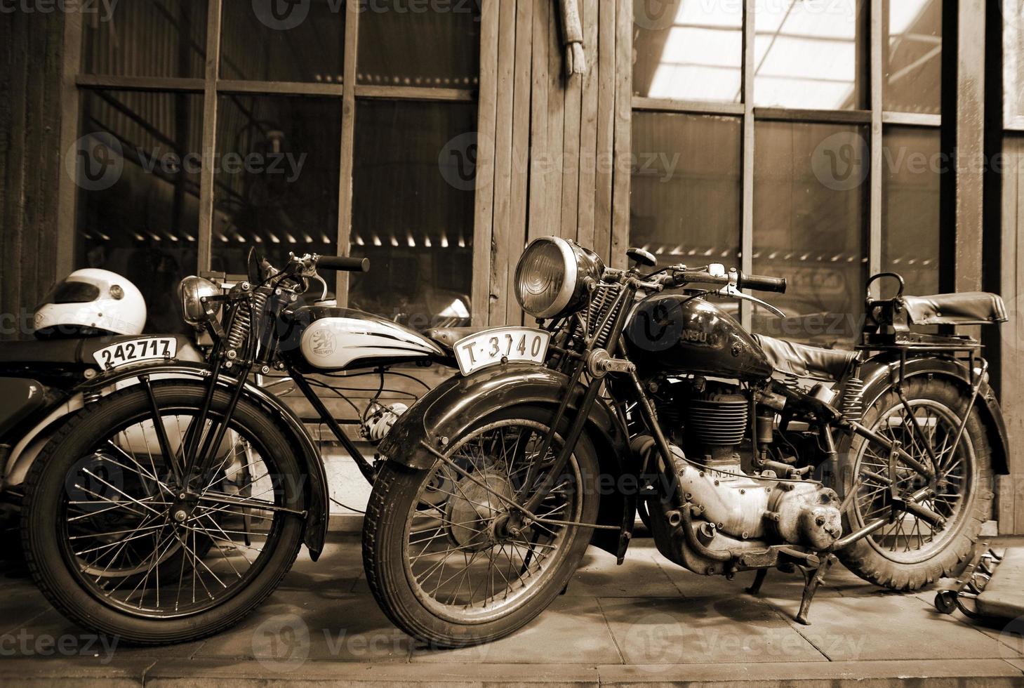 original old vintage retro vintage motorbikes standing in the museum photo