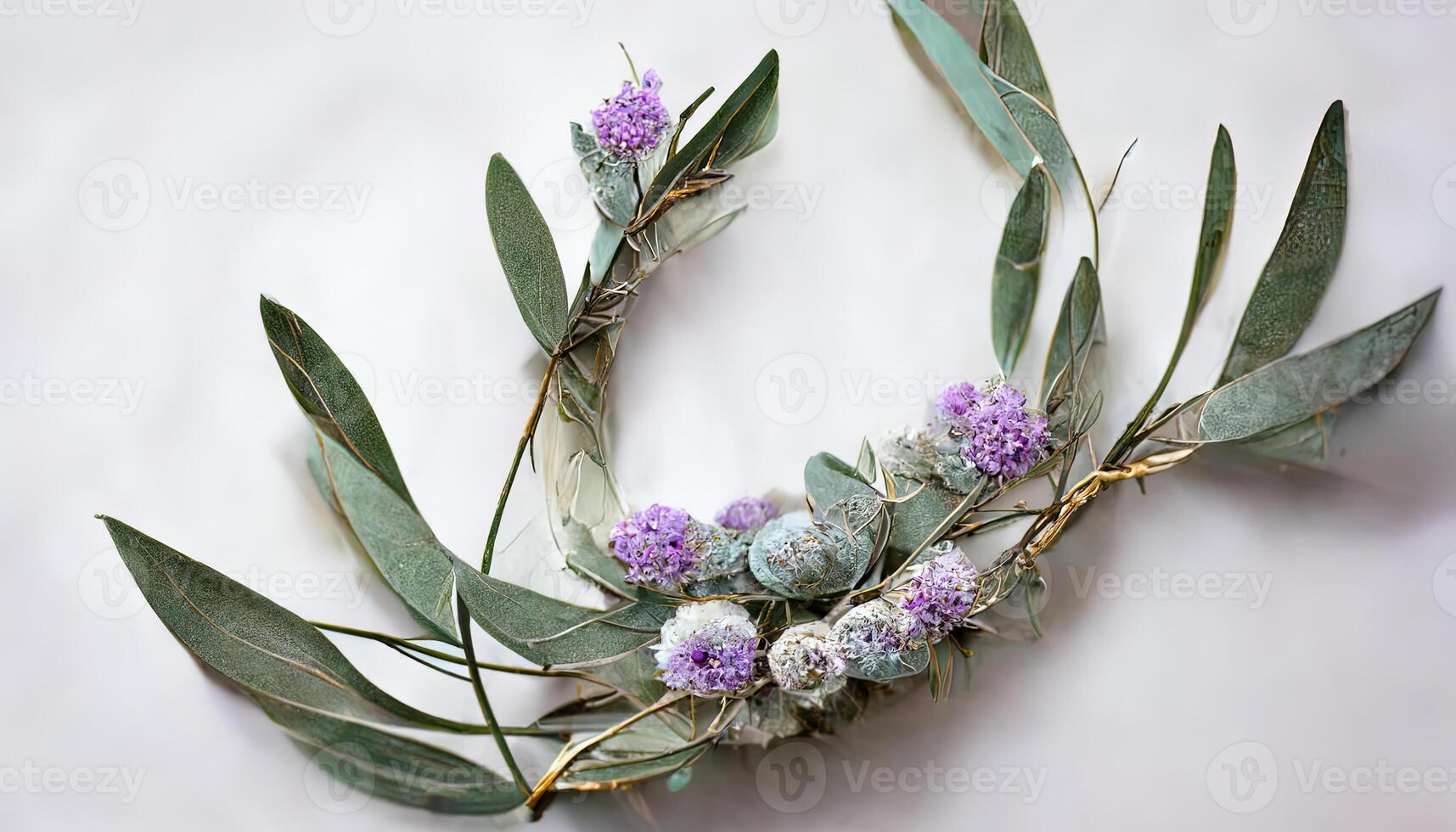 Lavender eucalyptus leaves, sage, and olive branches make up this flower frame from a digital watercolor painting that is isolated on white. photo