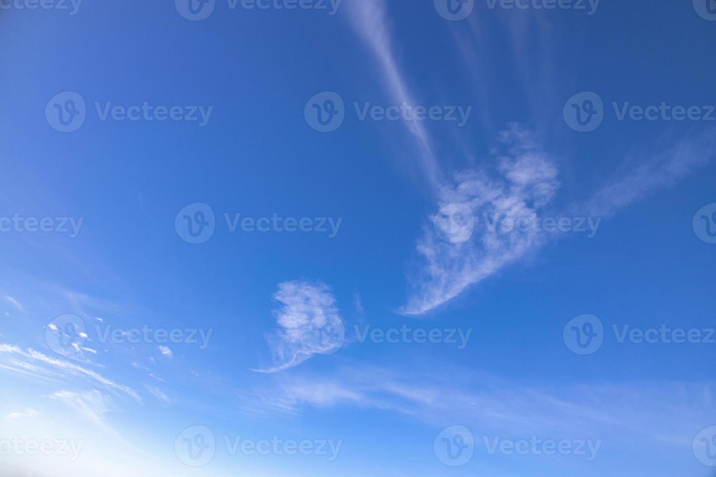 blue sky background with white clouds on a warm summer day photo