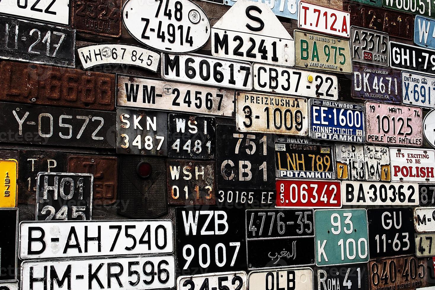 Various old car license plates from around the world at the museum photo