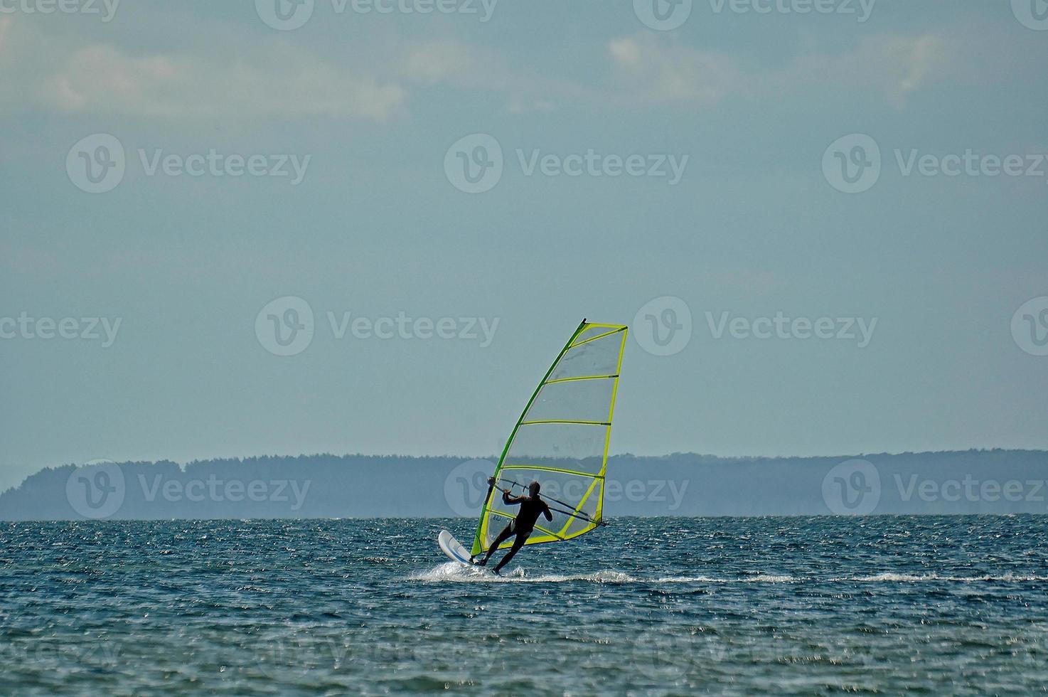 windsurfing on the bay of pucka on the baltic sea photo