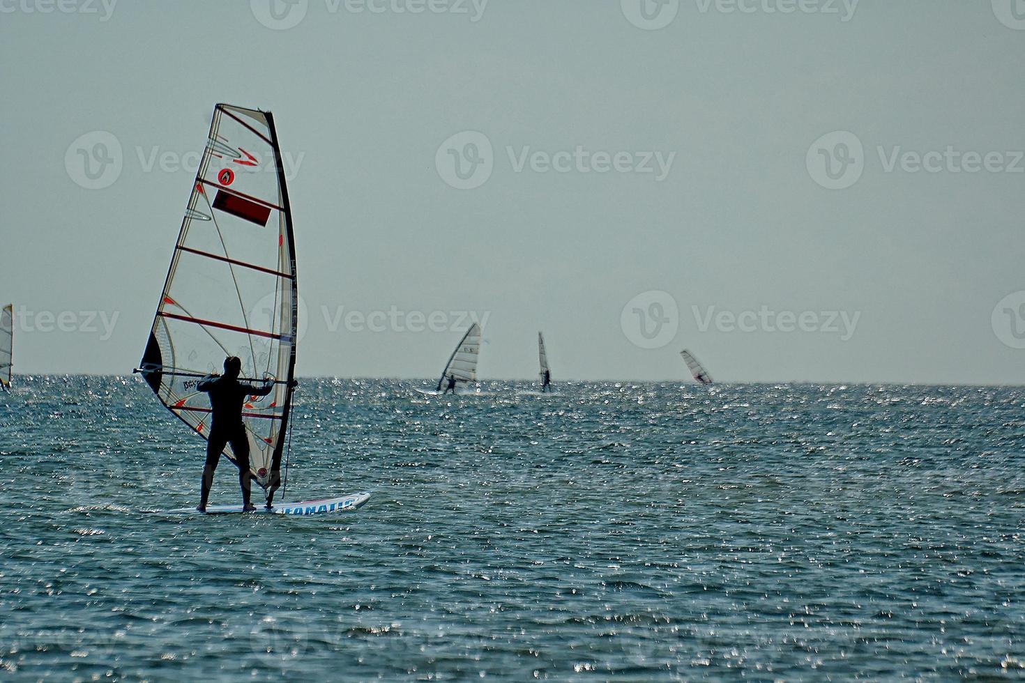 windsurfing on the bay of pucka on the baltic sea photo